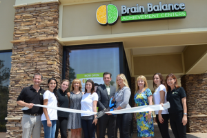 employees in front of a brain balance center