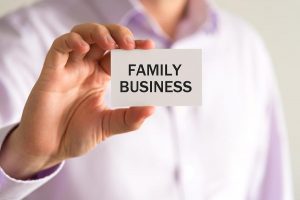 holding a family business card