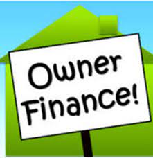owner finance sign in front of a house